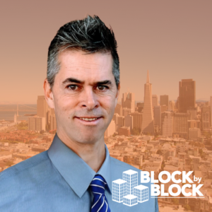 Block by Block West Coast District Vice President Chip in front of San Francisco Skyline