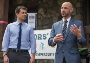Aaron Perri stands with former South Bend Mayor Pete Buttigieg